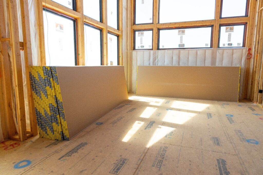 Drywall sheets staged inside Northern Utah residential jobsite